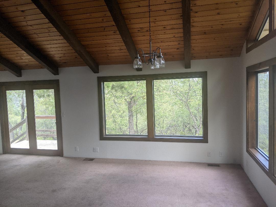 12877 Bobs Mountain Road Redding, CA 96003 - Photo 10 of 51 an empty room with a window