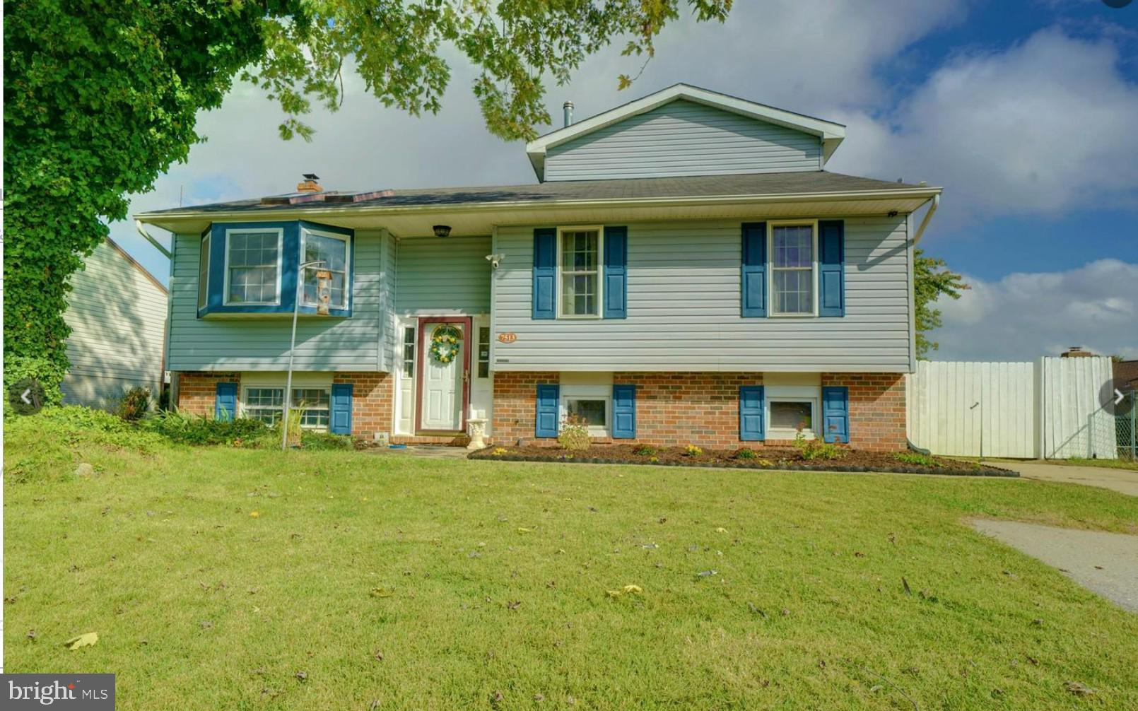 7513 Saffron Court Hanover, MD 21076 - Photo 2 of 42 a front view of a house with a yard