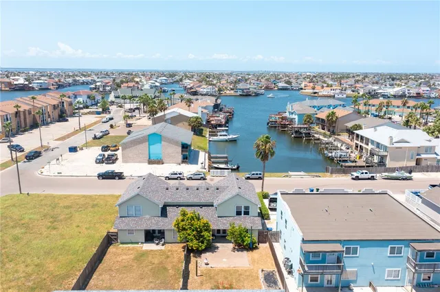 an aerial view of a city with ocean view