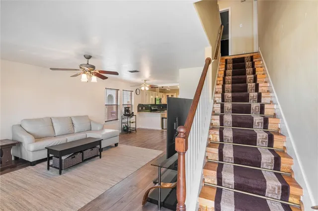 a living room with furniture and a rug