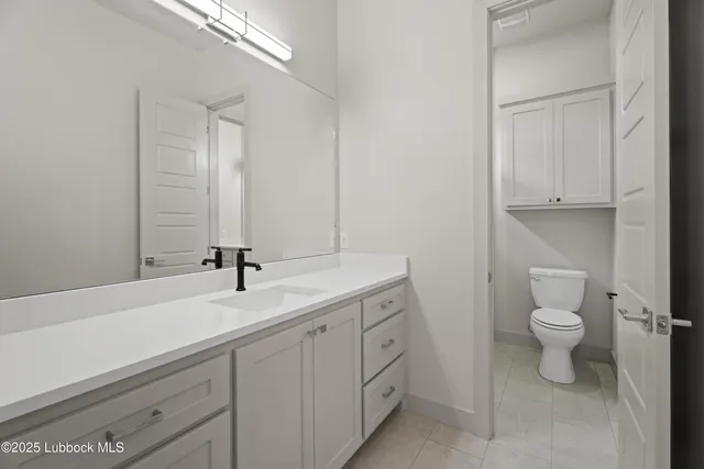 en empty room with windows and fan