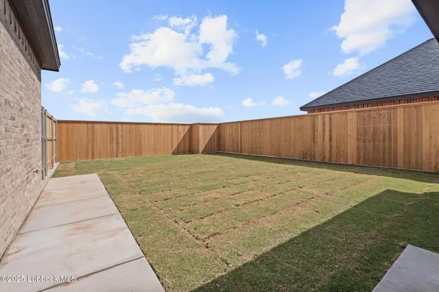 a view of a hallway with brick walls