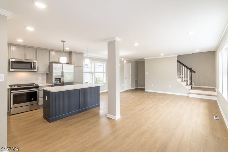 1801 Front Street, Unit A Scotch Plains, NJ 07076 - Photo 12 of 31 a large kitchen with stainless steel appliances granite countertop a stove a sink and a refrigerator