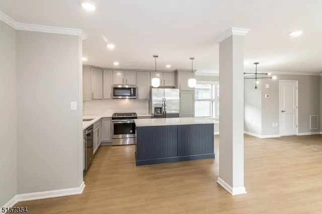 a view of a kitchen with a sink and dishwasher