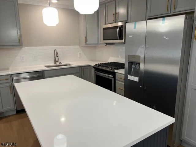 a bedroom with a bed and a large mirror