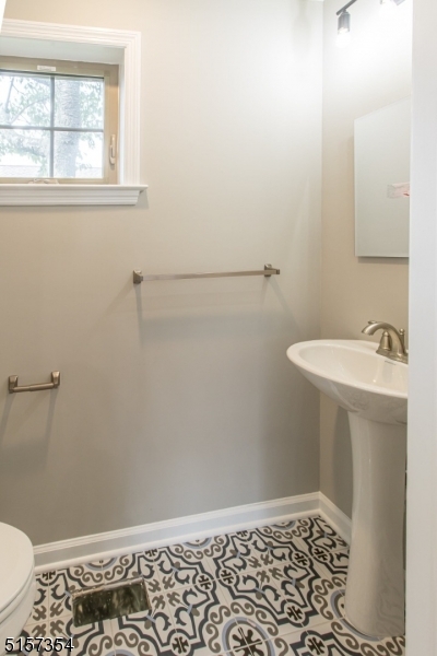 1801 Front Street, Unit A Scotch Plains, NJ 07076 - Photo 18 of 31 a bathroom with a sink a toilet