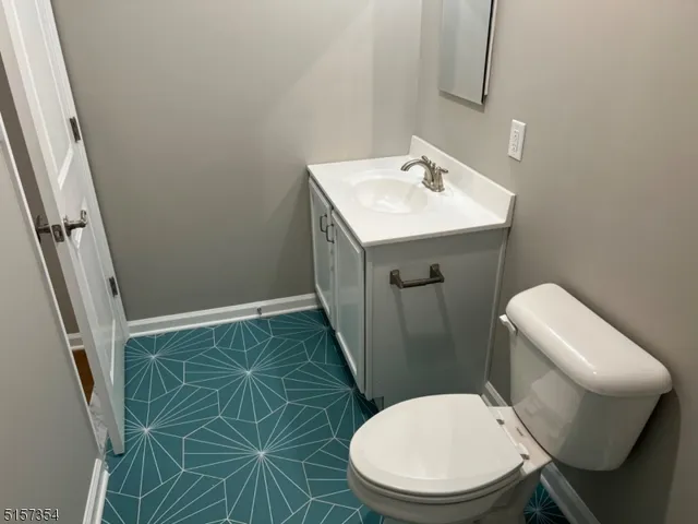 a white toilet sitting next to a bath tub
