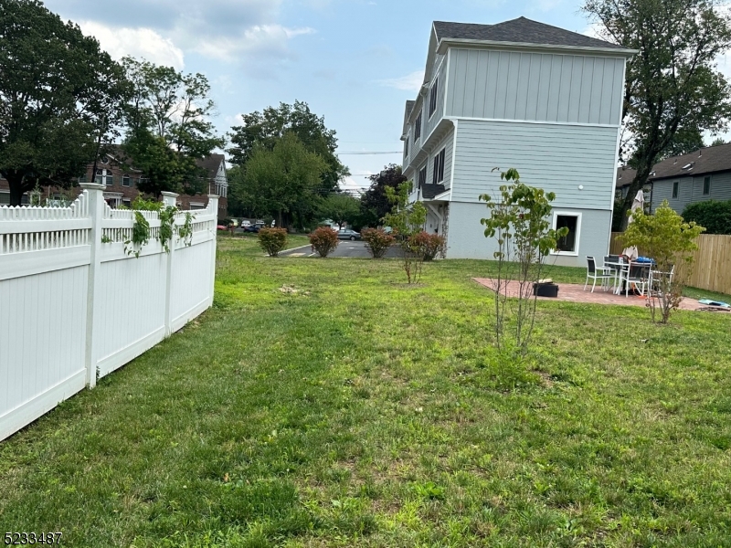 1801 Front Street, Unit A Scotch Plains, NJ 07076 - Photo 31 of 31 a backyard of a house with table and chairs