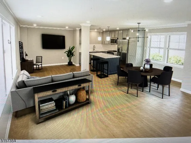 a living room with furniture a large window and a flat screen tv