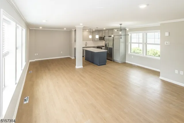 a view of a kitchen with a sink and a stove top oven
