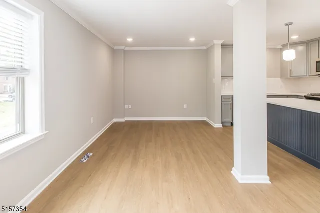 a view of a kitchen with a sink and a window