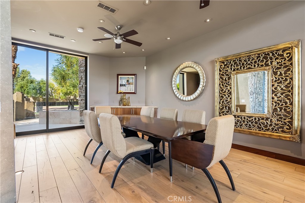 68 Royal St Georges Way Rancho Mirage, CA 92270 - Photo 30 of 75 a dining room with furniture and window