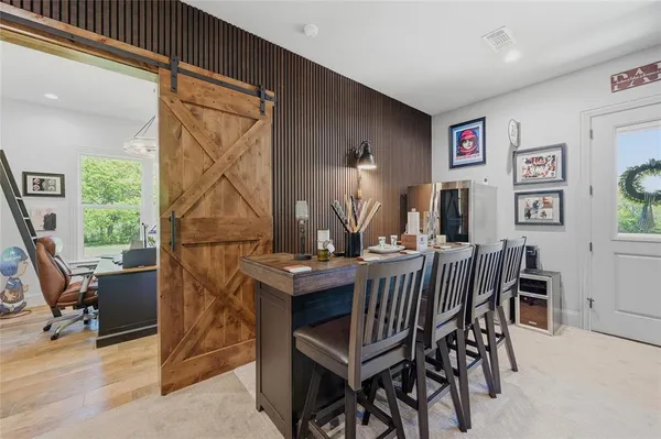 a view of a dining room with furniture window and wooden floor