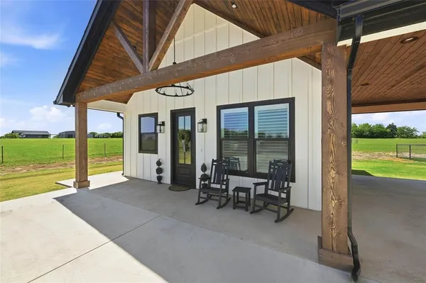 a view of a patio with a backyard