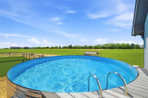a view of a swimming pool and a lake view