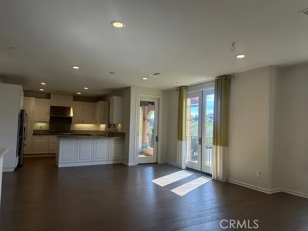 a view of kitchen with cabinets and wooden floor