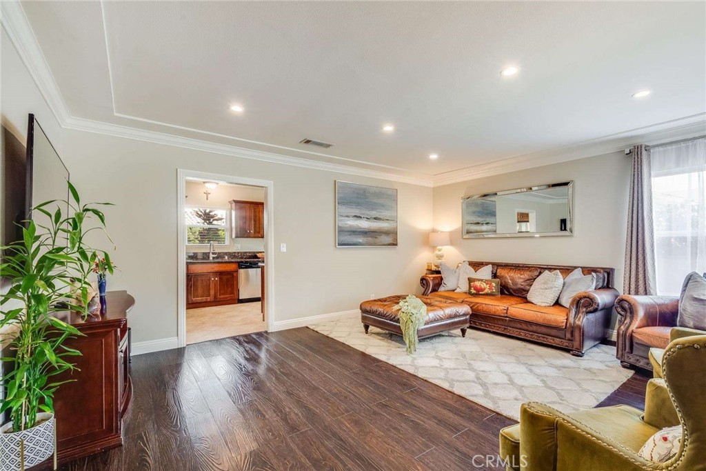 749 East Baseline Road San Dimas, CA 91773 - Photo 8 of 35 a living room with furniture and a potted plant