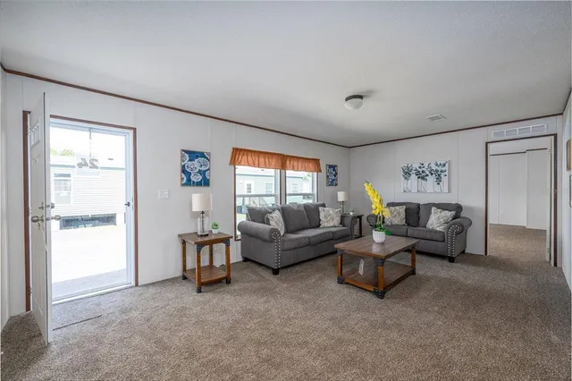 a living room with furniture and a window