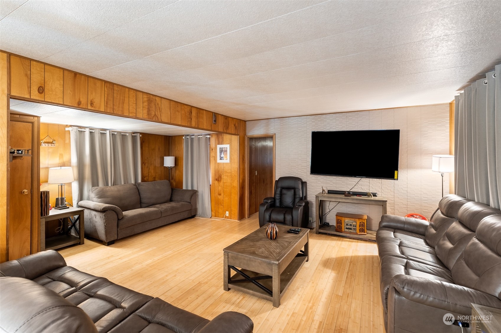 17210 Entiat River Road Entiat, WA 98822 - Photo 13 of 37 a living room with furniture and a flat screen tv