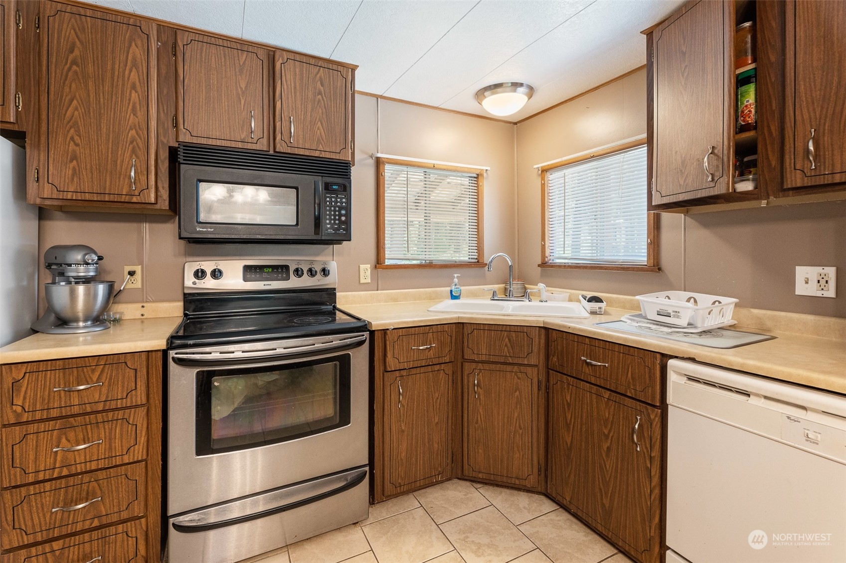 17210 Entiat River Road Entiat, WA 98822 - Photo 18 of 37 a kitchen with sink cabinets and appliances