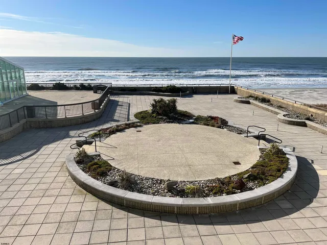 a view of a swimming pool with lawn chairs