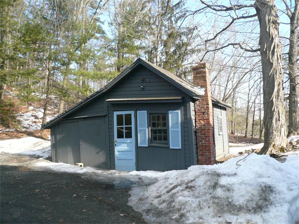 563 Montague Road Amherst, MA 01002 - Photo 13 of 15 a front view of a house with a yard and garage