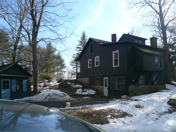 563 Montague Road Amherst, MA 01002 - Photo 15 of 15 a view of a house with a yard covered in snow