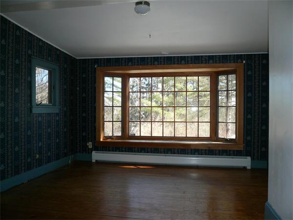 563 Montague Road Amherst, MA 01002 - Photo 5 of 15 a view of empty room with wooden floor and fan