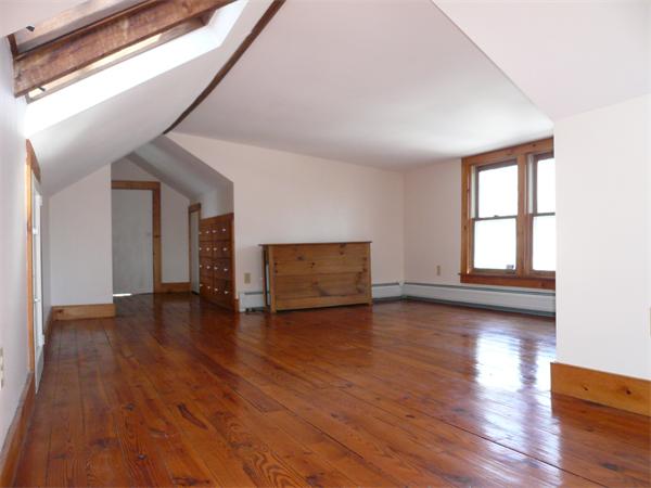 563 Montague Road Amherst, MA 01002 - Photo 10 of 15 a view of empty room with wooden floor and fan