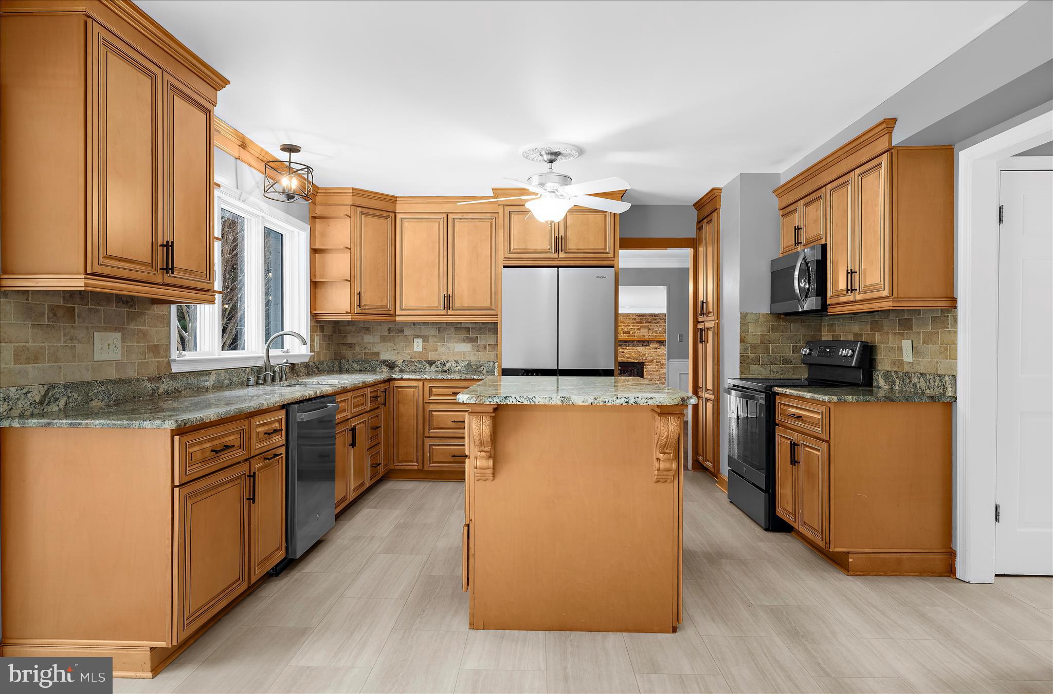 3300 Paper Mill Road Phoenix, MD 21131 - Photo 23 of 91 a kitchen with stainless steel appliances granite countertop a stove top oven a sink a counter space and cabinets