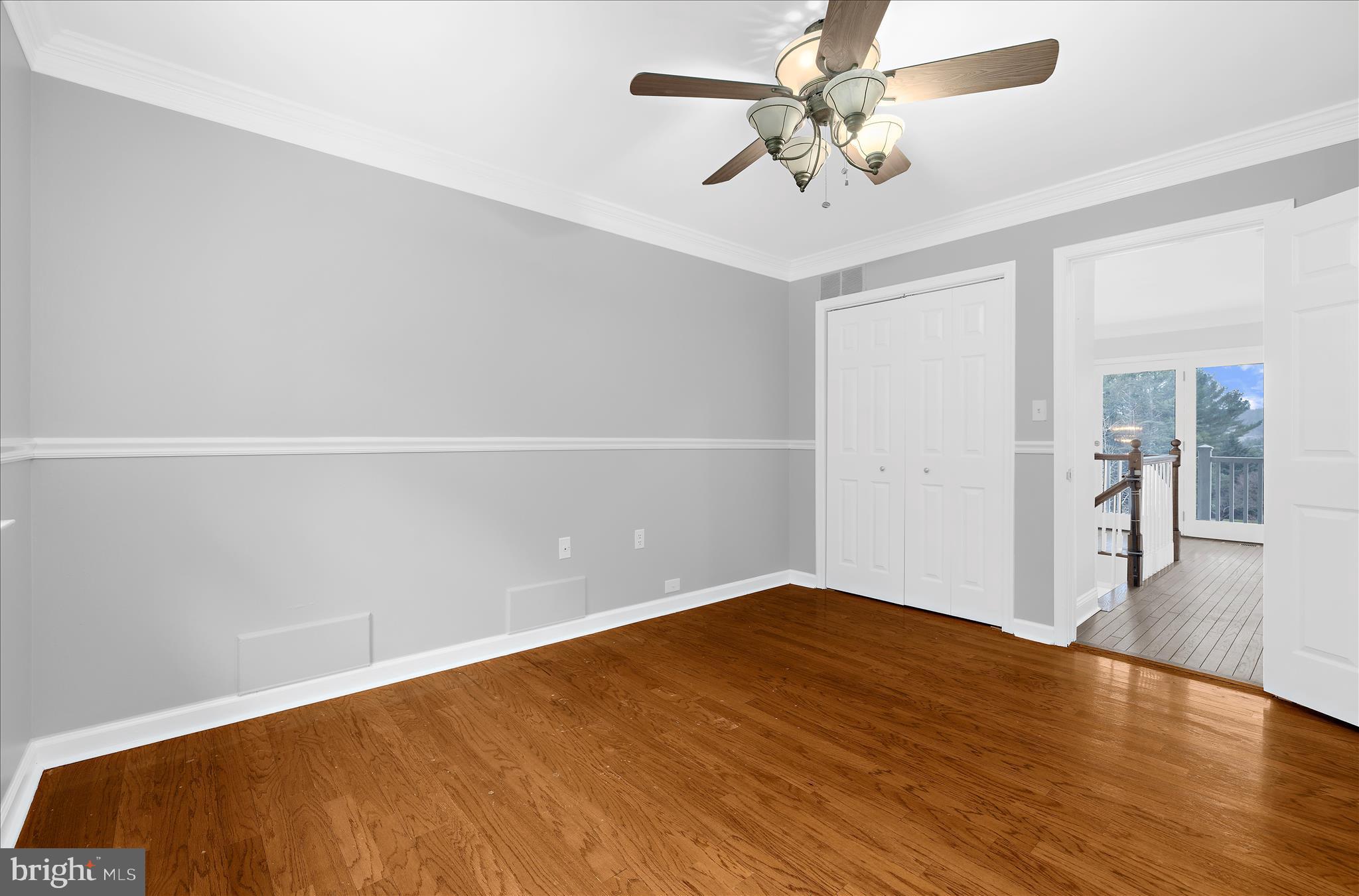3300 Paper Mill Road Phoenix, MD 21131 - Photo 44 of 91 wooden floor in an empty room with a chandelier fan