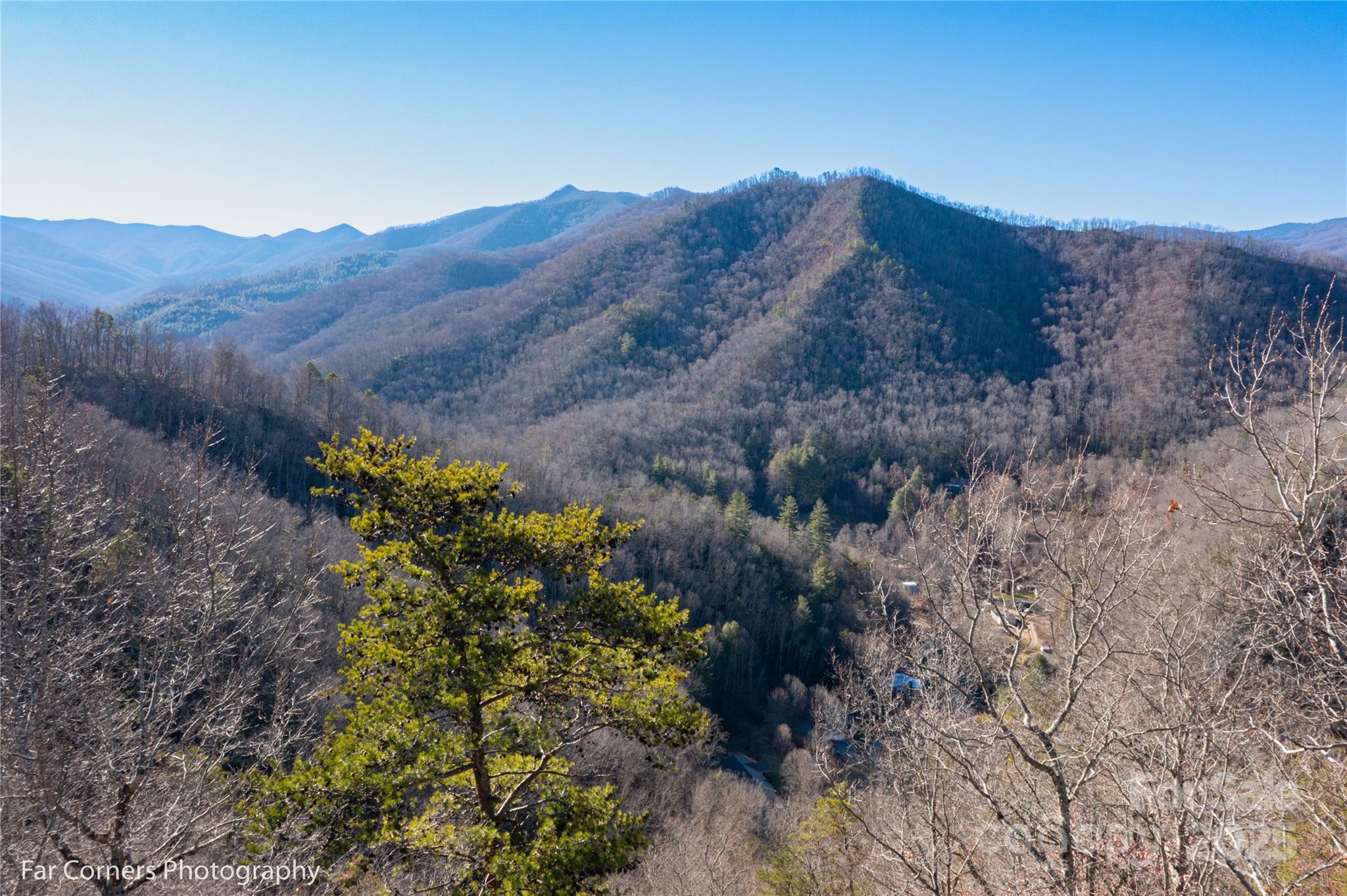0 Sourwood Road Canton, NC 28716 - Photo 32 of 35 a view of a house with a mountain and a forest