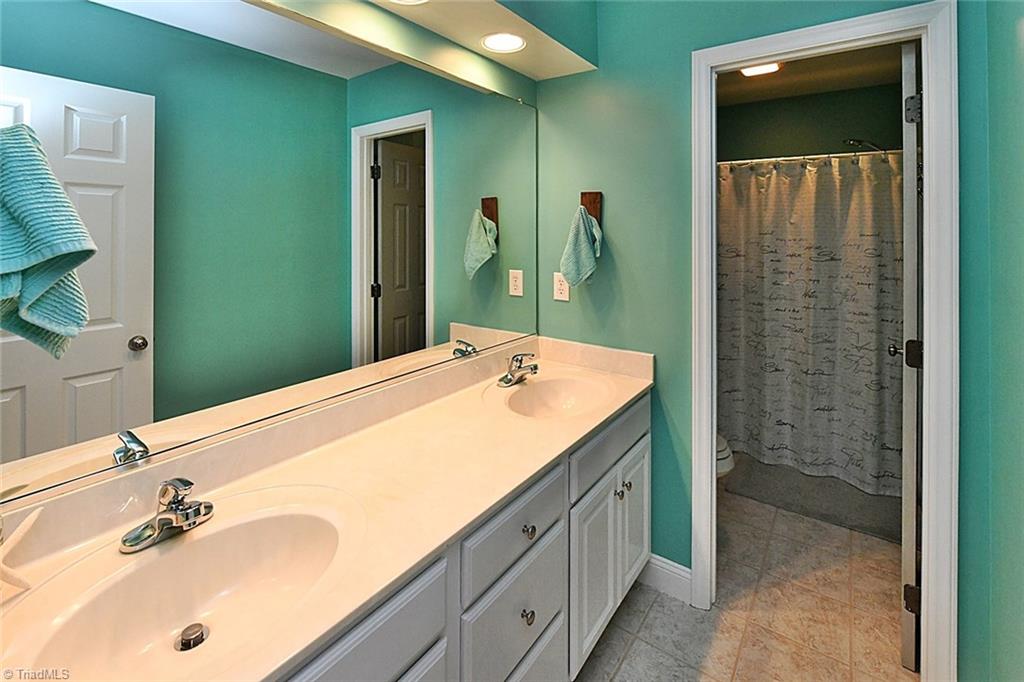 171 March Ferry Road Advance, NC 27006 - Photo 21 of 29 Second full upstairs bath with two sinks, good counter space, and separate tub/shower & commode space