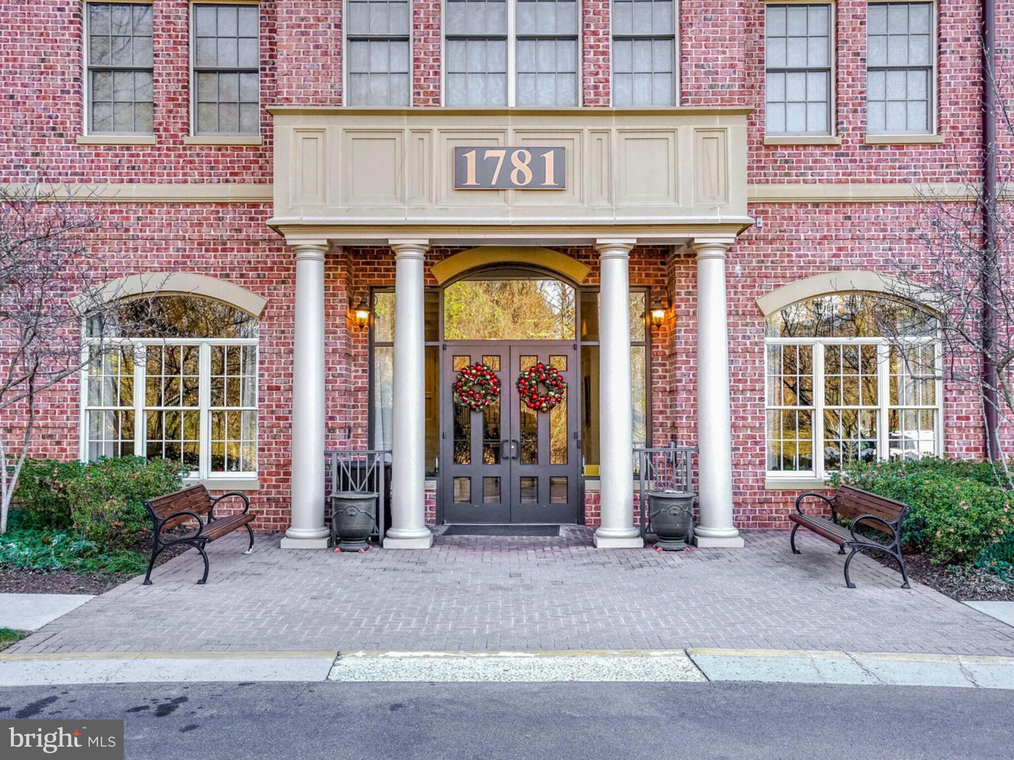 1781 Chain Bridge Road, Unit 307 McLean, VA 22102 - Photo 1 of 18 a front view of a building with lots of windows and plants