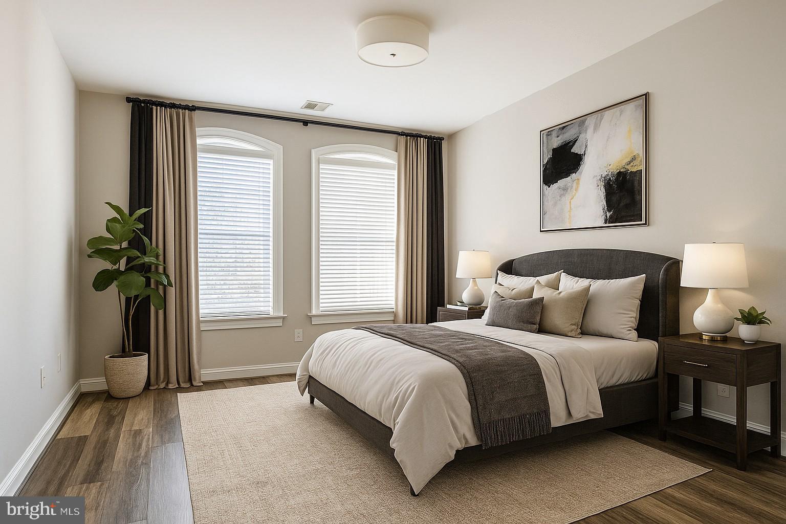 1781 Chain Bridge Road, Unit 307 McLean, VA 22102 - Photo 16 of 18 a bedroom with a bed and a potted plant