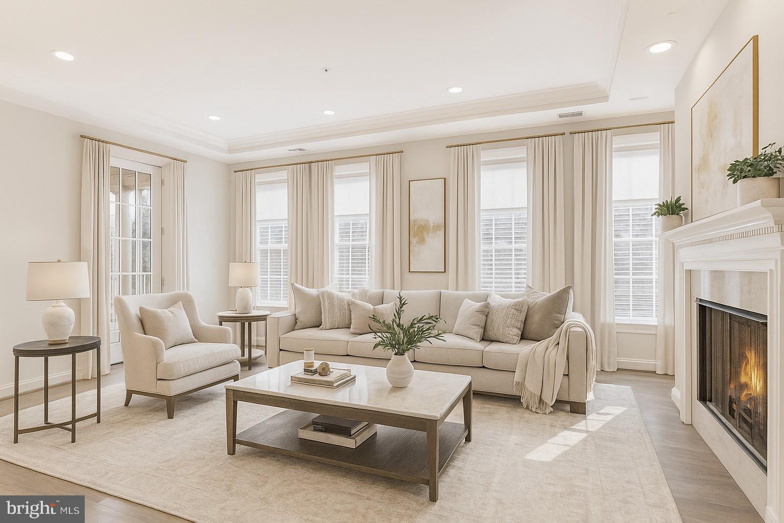 1781 Chain Bridge Road, Unit 307 McLean, VA 22102 - Photo 8 of 18 a living room with furniture and a fireplace
