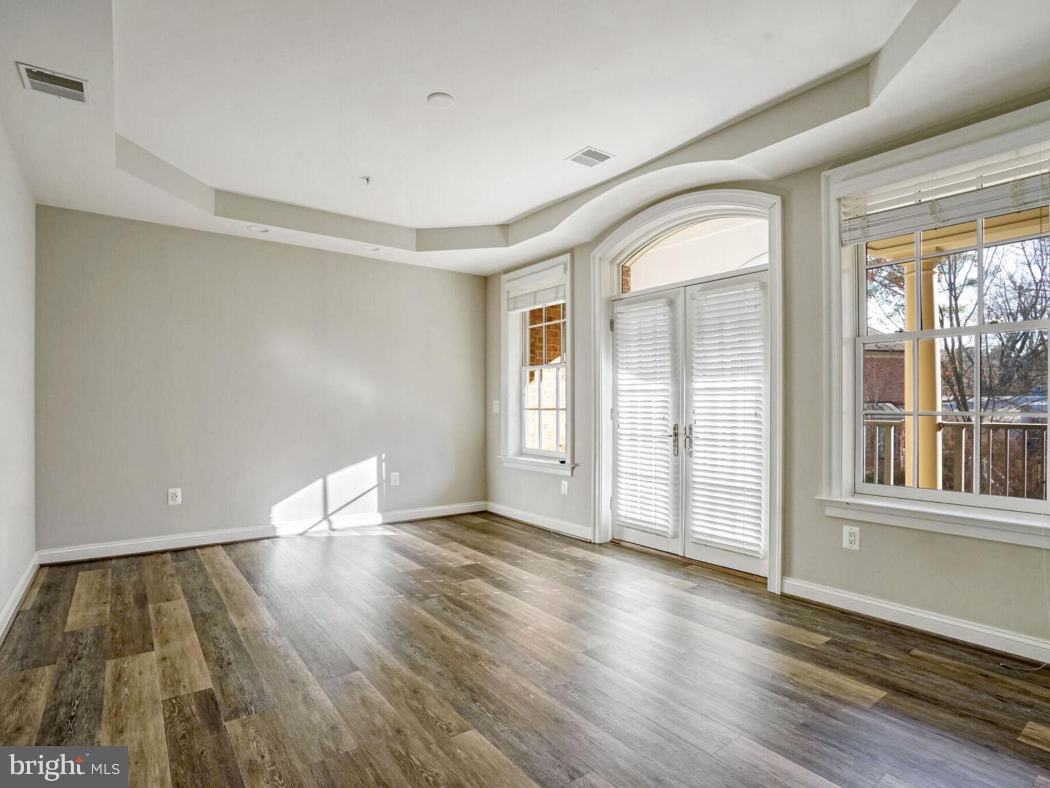 1781 Chain Bridge Road, Unit 307 McLean, VA 22102 - Photo 10 of 18 wooden floor in an empty room with a window