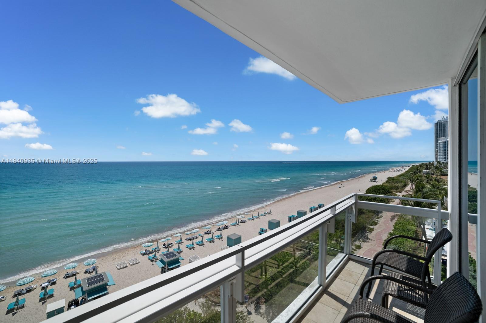 6801 Collins Avenue, Unit 705 Miami Beach, FL 33141 - Photo 2 of 54 a view of an ocean from a balcony