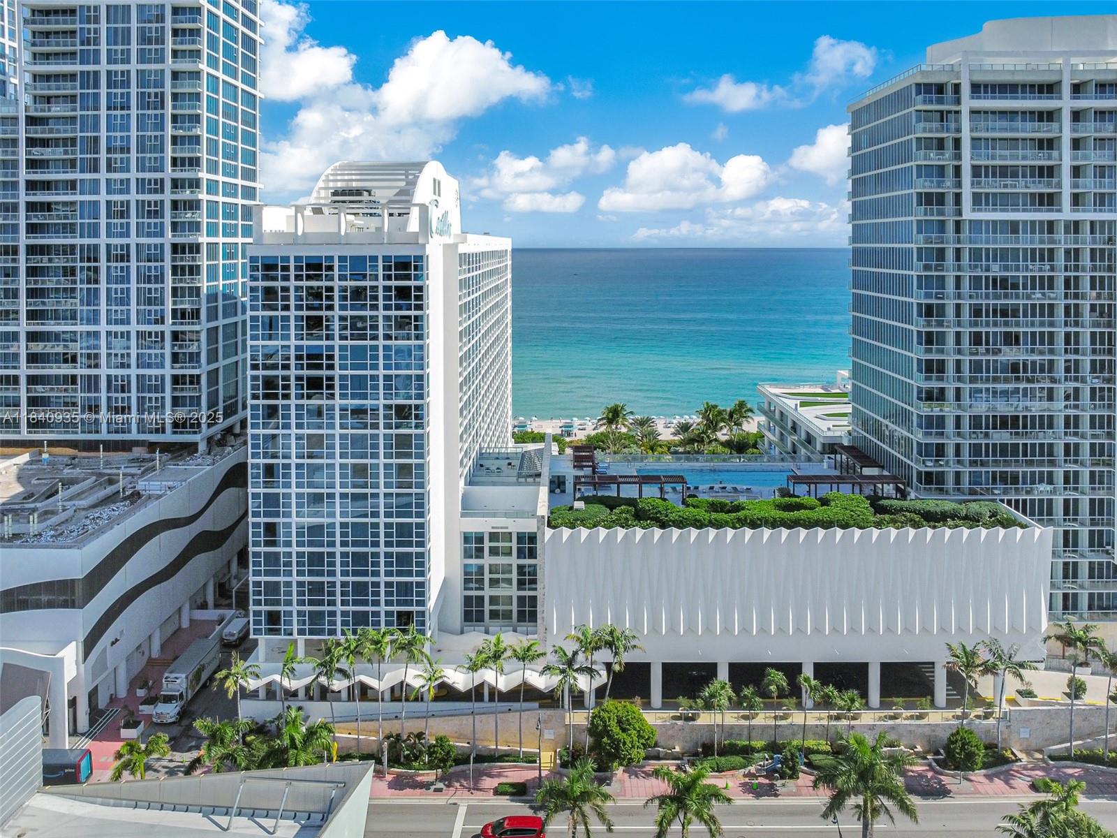 6801 Collins Avenue, Unit 705 Miami Beach, FL 33141 - Photo 24 of 54 a view of a garden and buildings