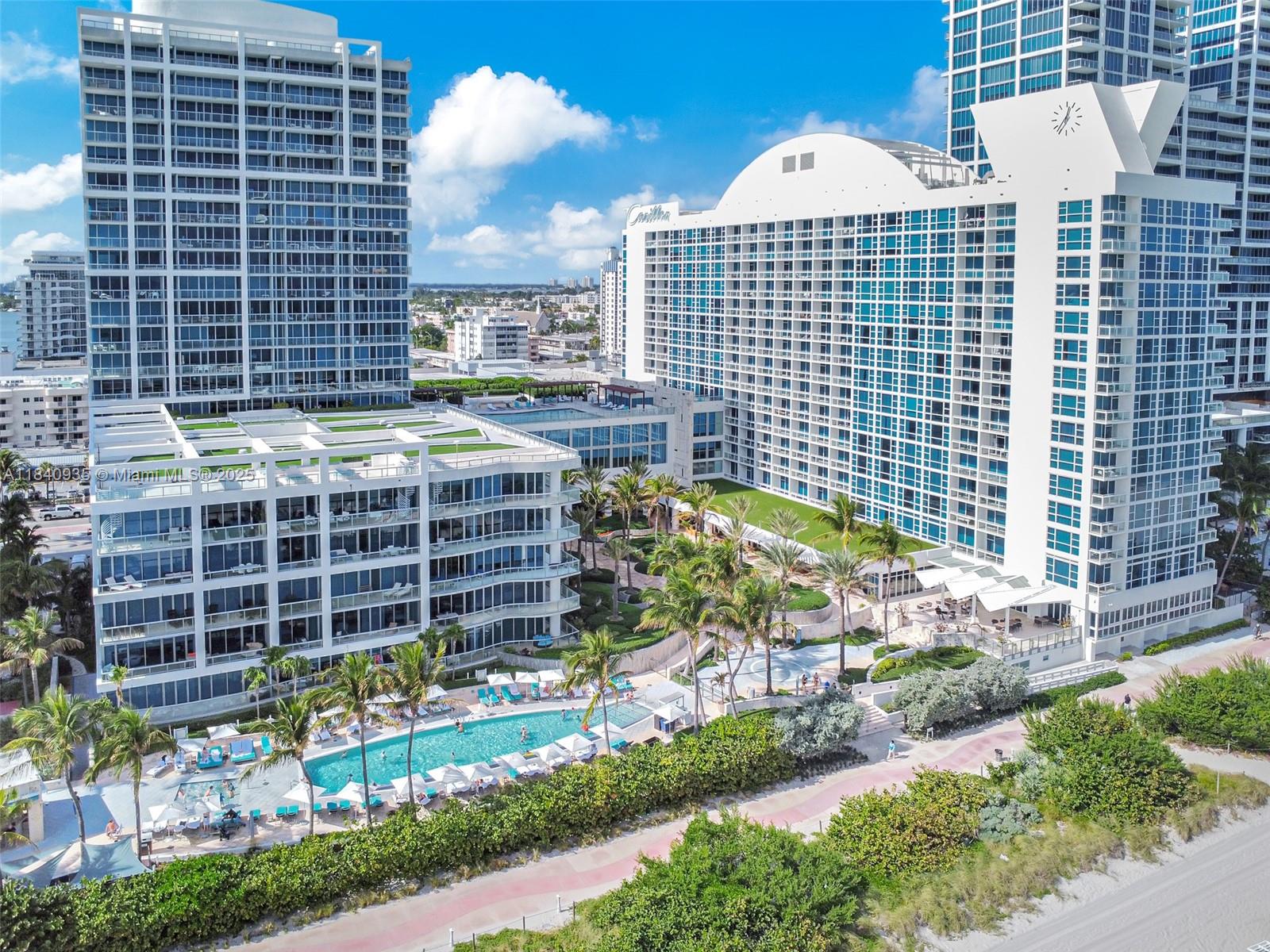6801 Collins Avenue, Unit 705 Miami Beach, FL 33141 - Photo 33 of 54 a view of a building with a yard