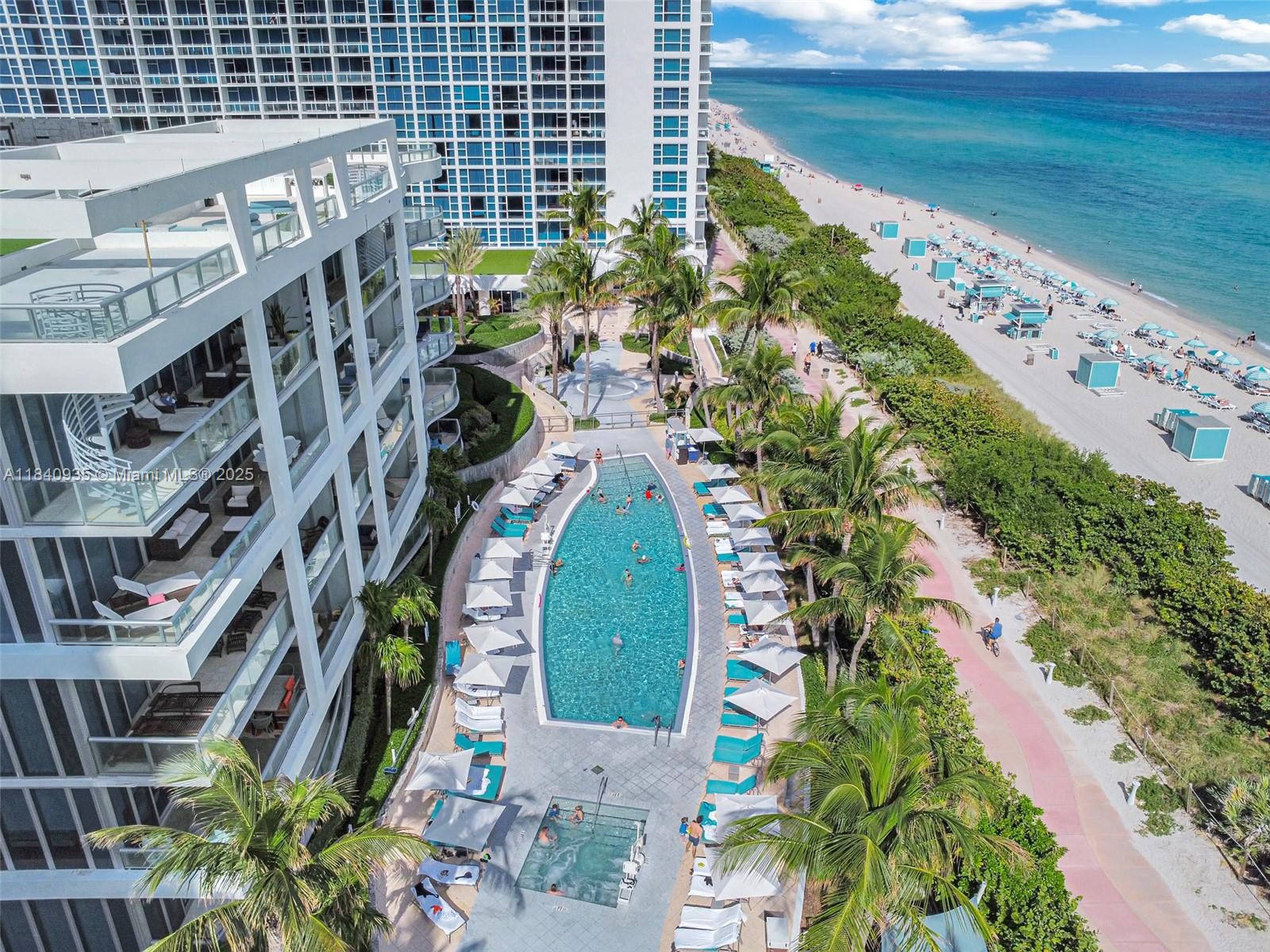 6801 Collins Avenue, Unit 705 Miami Beach, FL 33141 - Photo 34 of 54 a view of building with yard