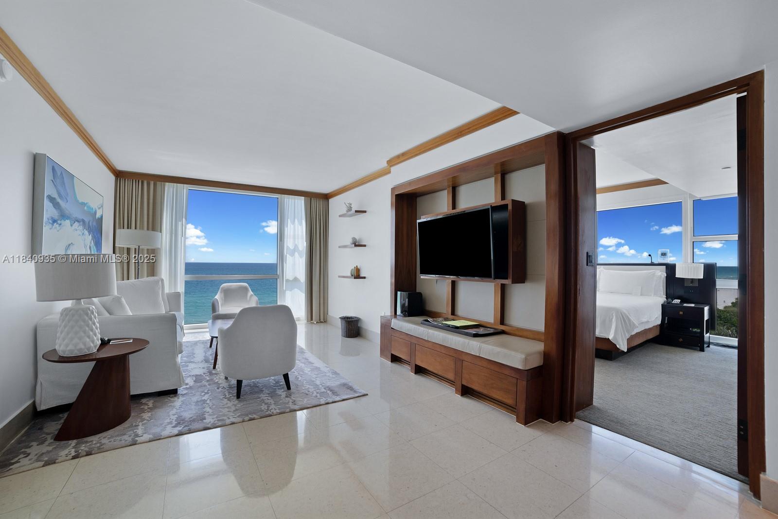 6801 Collins Avenue, Unit 705 Miami Beach, FL 33141 - Photo 4 of 54 a living room with furniture