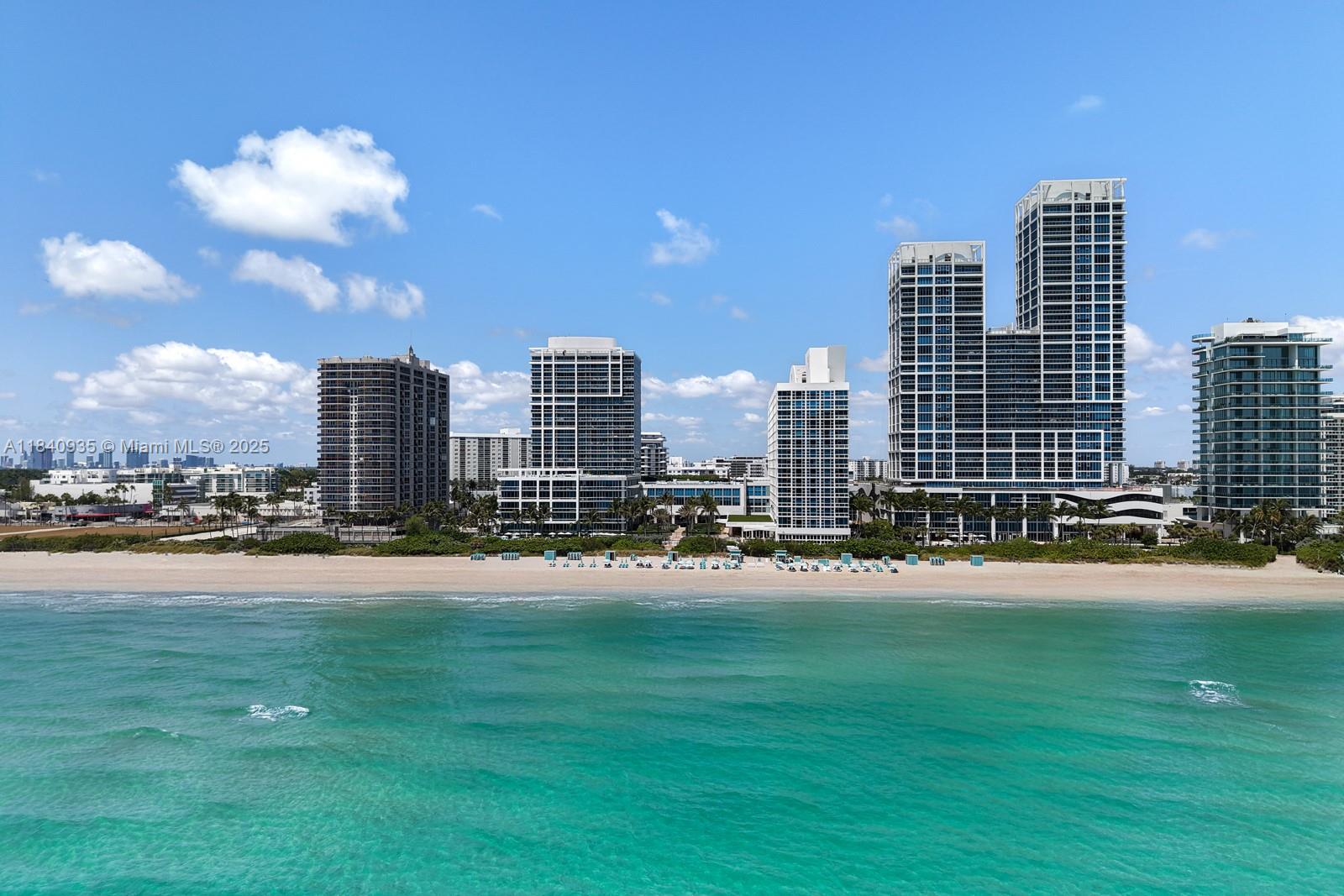 6801 Collins Avenue, Unit 705 Miami Beach, FL 33141 - Photo 43 of 54 a view of a city with tall buildings and a big yard