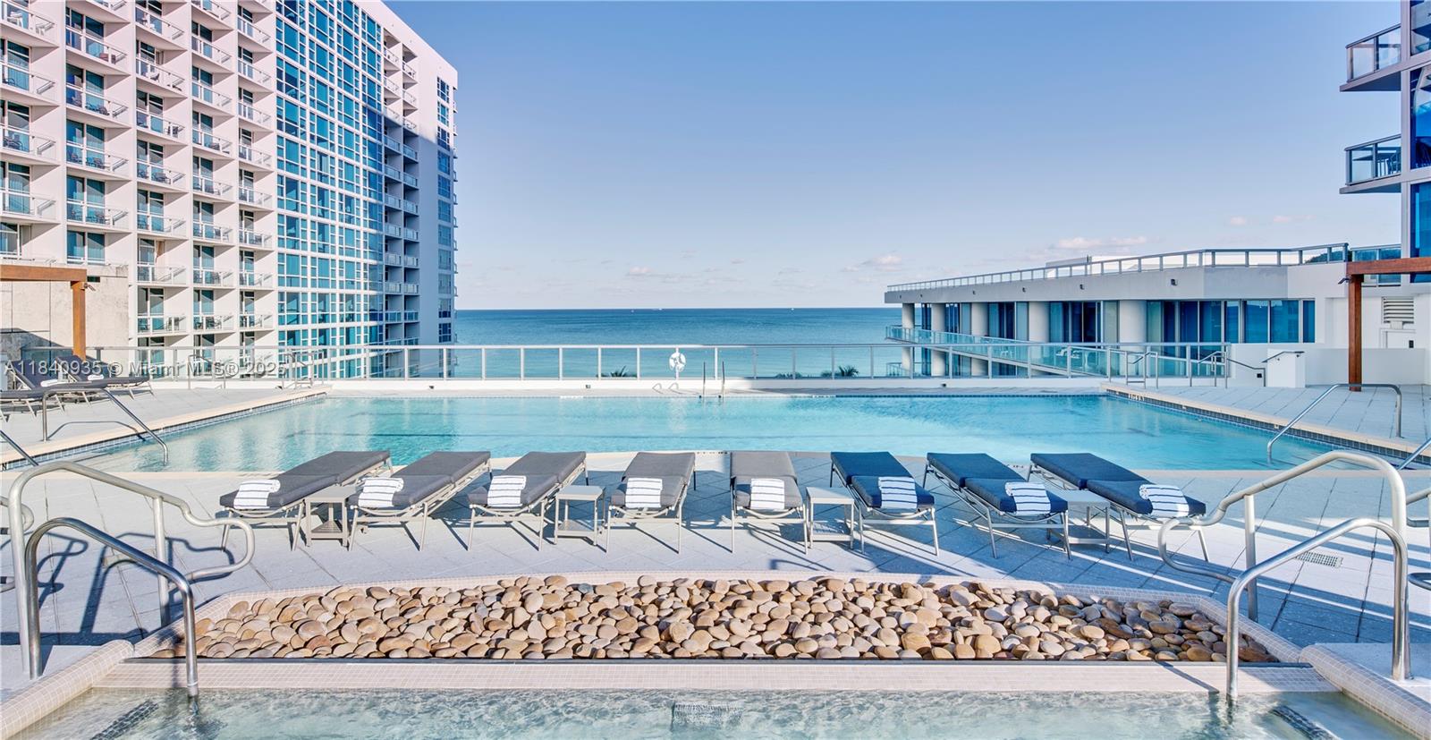 6801 Collins Avenue, Unit 705 Miami Beach, FL 33141 - Photo 47 of 54 a view of a chairs and table on the terrace