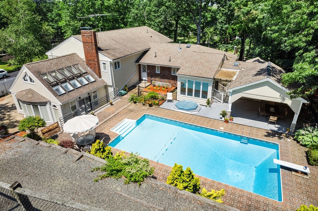 27 Rutgers Road Andover, MA 01810 - Photo 1 of 42 an aerial view of a house with a garden and lake view