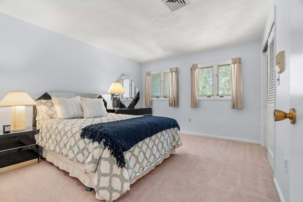 27 Rutgers Road Andover, MA 01810 - Photo 20 of 42 a bedroom with a bed and window