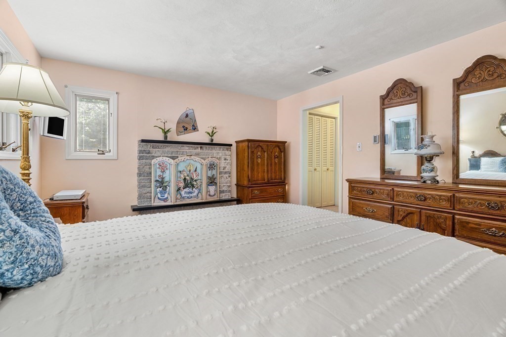 27 Rutgers Road Andover, MA 01810 - Photo 22 of 42 a bedroom with a large bed and dresser