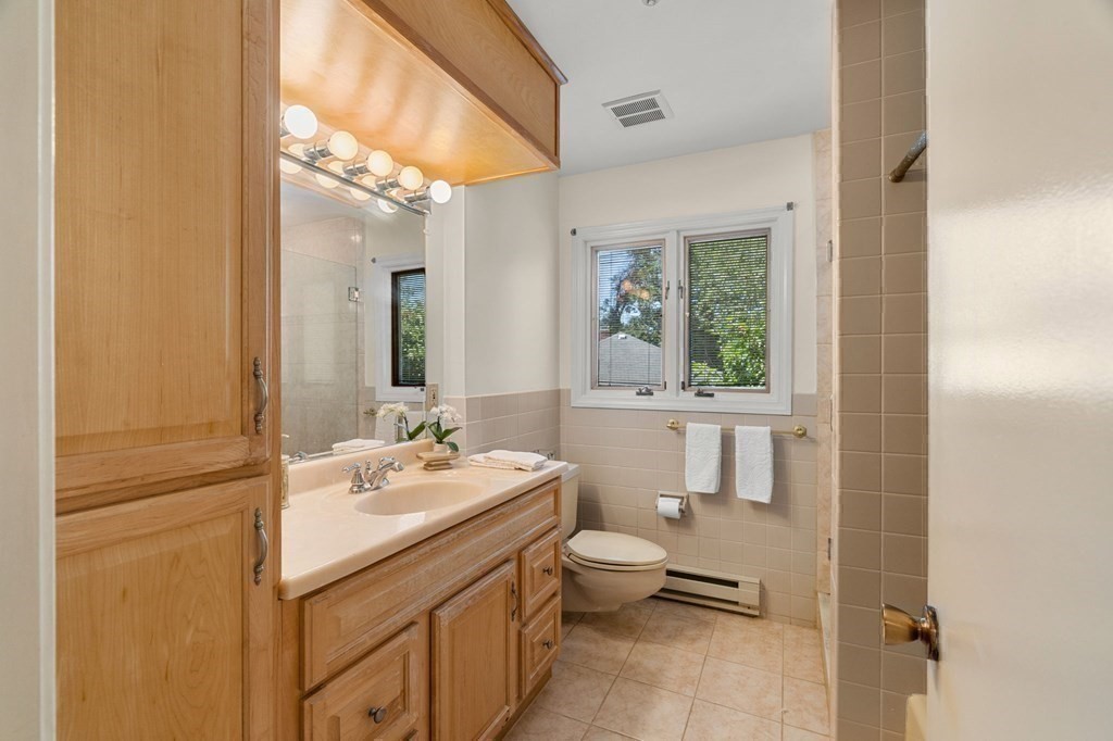 27 Rutgers Road Andover, MA 01810 - Photo 23 of 42 a bathroom with a sink toilet and mirror