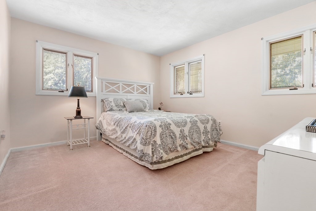 27 Rutgers Road Andover, MA 01810 - Photo 25 of 42 a bedroom with a bed and a window