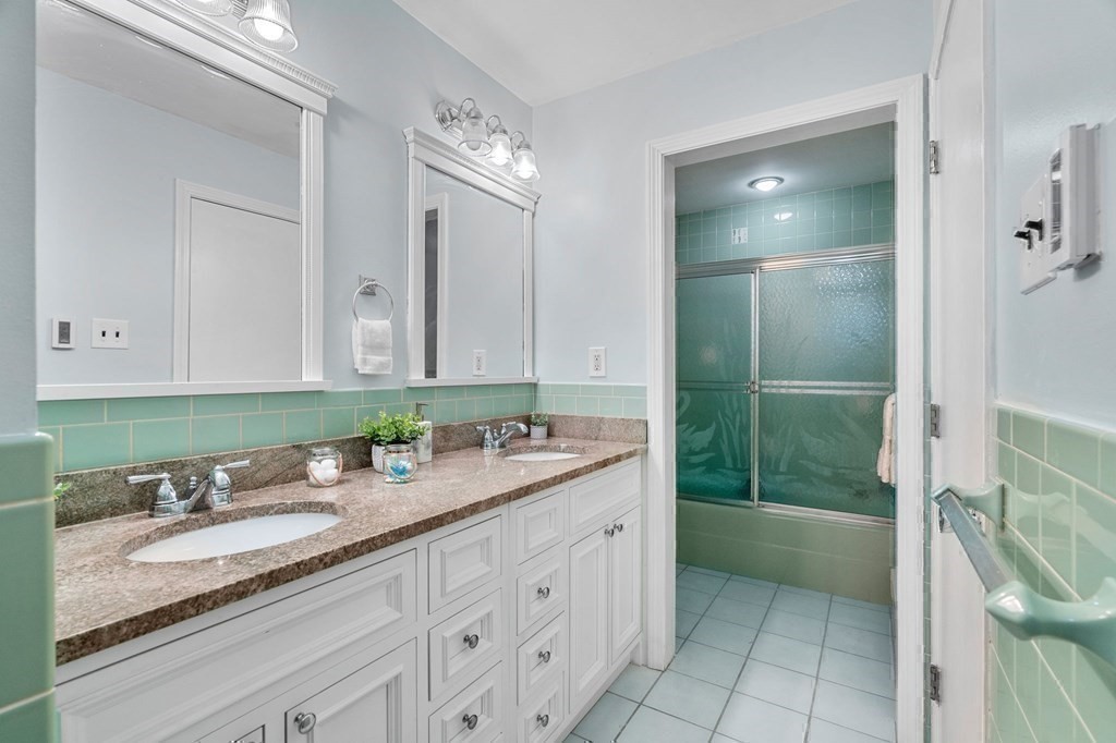 27 Rutgers Road Andover, MA 01810 - Photo 26 of 42 a bathroom with a granite countertop sink mirror and shower